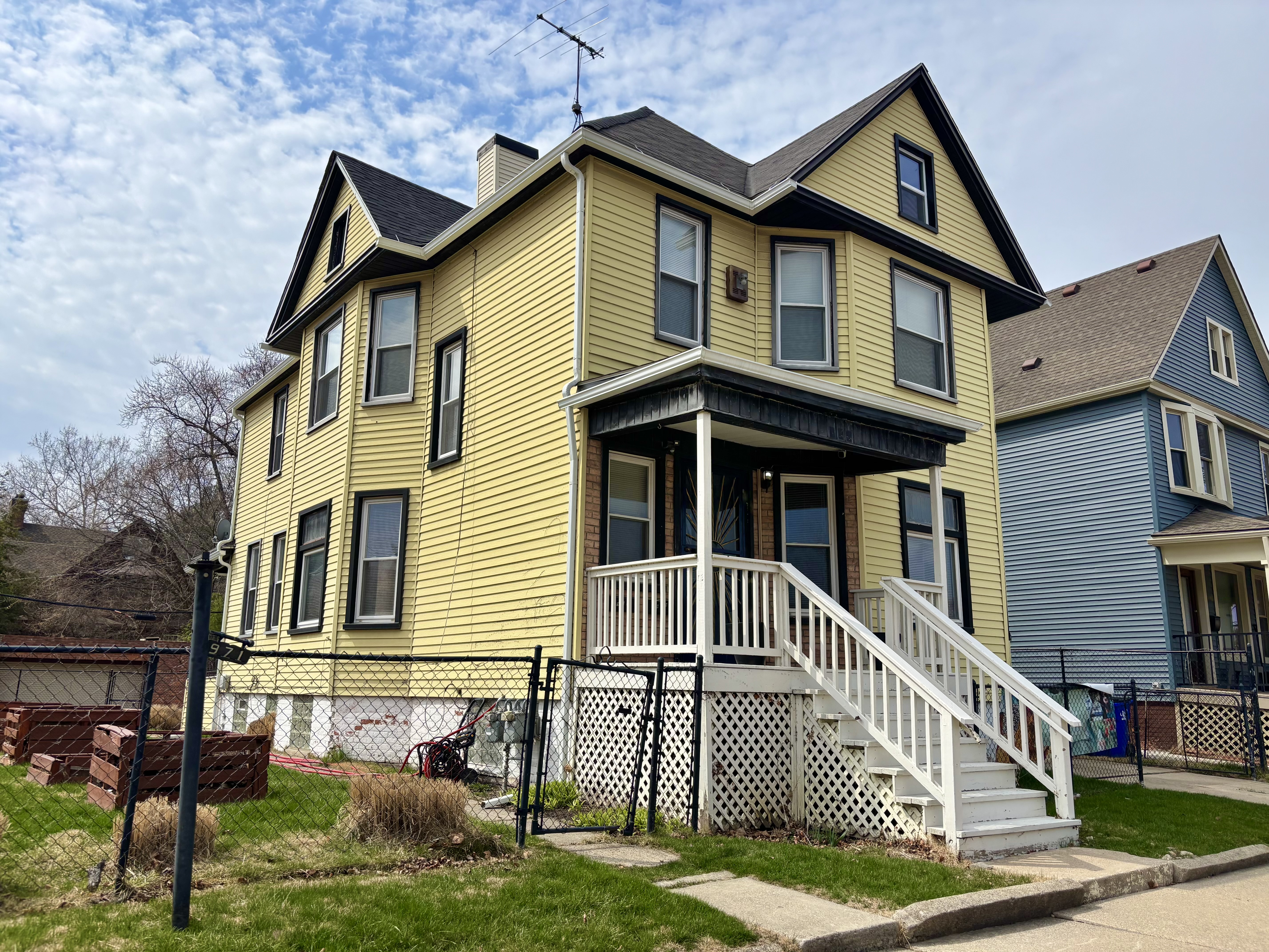 A yellow two-story house.